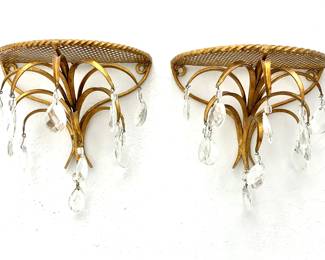 LOT 86 Register: www.woodardlipe.com PAIR ITALIAN GILT AND CRYSTAL DEMILUNE WALL SHELVES Length 8.5 in, width 6.75 in, depth 4.25 in. Hollywood Regency style Italian gilt wall brackets with crystal droplets and leaf motif.