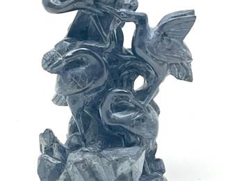 LOT 43 Register: www.woodardlipe.com CARVED SOLID SLATE: 4 CRANES Height 4 in., width 4 in., depth 2.5 in. Four cranes carved in relief into a smooth fine grained dark gray slate. Symbolism