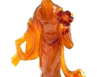 LOT 57 Register: www.woodardlipe.com HAND-CARVED KWAN YIN IN CARNELIAN STONE ON WOOD BASE Length 3 in, depth 1.25 in, height 4 in, without base. Weight 97 grams. Kwan Yin is the Chinese goddess of mercy and compassion. She is depicted wearing a long robe, her hair in a high bun holding a flower. Carnelian gives serenity, protects the blood and helps with difficult decisions. It enhances positive emotions, protects against bad emotions and helps with concentration.
