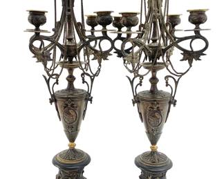 LOT 90 Register: www.woodardlipe.com PAIR FRENCH NEOCLASSICAL FIVE ARM CANDELABRA, MID 19TH C. WITH FLORAL AND CAMEO REPOUSSE DESIGN Diameter 9 in, height 21.75 in. Pair of ornate candelabras feature a cameo of a young man on one side and a soldier on the other side. Repousse acanthus leaf and floral design in neoclassical style on black stone base.