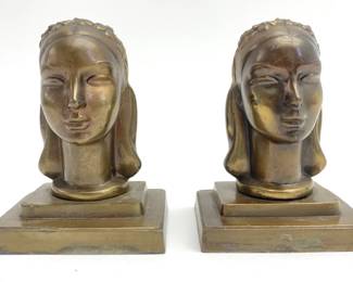 LOT 89 Register: www.woodardlipe.com PAIR ARTHUR VON FRANKENBERG ART DECO MAIDEN BOOKENDS Length 4.75 in, width 3.75 in, height 6 in. Pair of bronze bookends from Frankart by Arthur Von Frankenberg, this pair of Art Deco style bookends features a young woman's head with floral headband on a metal stand. Stamped on the underside of the stand and back of the piece.