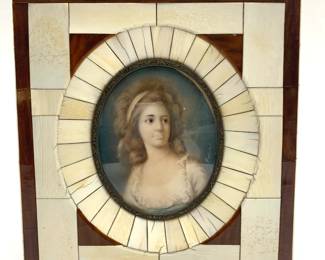 LOT 127 Register: www.woodardlipe.com ANTIQUE MINIATURE PORTRAIT OF A WOMAN IN BONE AND WOOD FRAME Antique miniature portrait painting in an ivory and wood frame, signed on the right side.The back is a German historical legal document from early 17th century Germany. Some wear consistent with age.