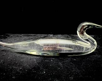 LOT 24 Register: www.woodardlipe.com PAIR OF STEUBEN CRYSTAL GLASS GEESE FIGURINES, STANDING AND PREENING Height 5.25 in, 3.5 in, length 3 in, 4 in, depth 2 in, 2 in. Pair of crystal geese, one standing with neck outstretched and the other preening its feathers, these figures are excellent examples of the beautiful clear glass for which Steuben is known. Both are etched Steuben on the underside.