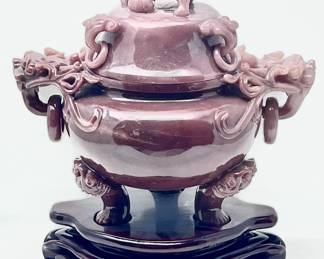 LOT 76 Register: www.woodardlipe.com INCENSE BURNER, HUNAN JADE, CARVED WITH LOOSE RINGS ON BOTH LID AND BODY, CHING DYNASTY, KUANG HSU PERIOD Height 7.75 in., width 6.75 in., depth 4.5 in., Total weight 1248 grams. Carved lidded incense burner associated with Henan Province, with 6 distinct loose rings on lid and body. Dusty Rose in color. Ching Dynasty, Kuang Hsu Tung Pao, 1875-1908.