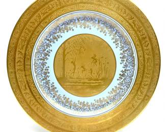 LOT 123 Register: www.woodardlipe.com SET 4 BAVARIAN FAIRY ACID-EDGED BLUE AND GOLD SERVICE DINNER PLATES Diameter 11 in, Ornately decorated with fairies and nymphs, the rim of the plate is decorated with three bands of ornamentation. From Bavaria, Germany.