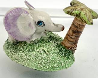 LOT 17 Register: www.woodardlipe.com BASIL MATHEWS ELEPHANT Length 2.5 in, depth 1.25 in, height 2 in. Mathews was a Welsh potter who concentrated on limited edition pieces, usually producing no more than about a hundred of each model. An internationally acclaimed designer and figurine artist he was a Fellow of the Royal Society of Arts, Member of the Society of Industrial Artists and Designers, and Fellow of the Society of Design Craftsmen.
