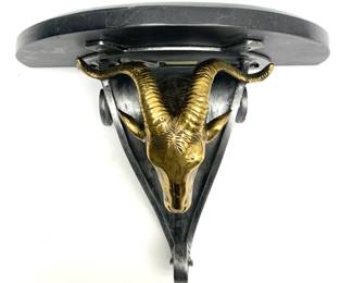 LOT 118 Register: www.woodardlipe.com MAITLAND SMITH RAMS HEAD WALL SHELF Length 16 in, width 8 in, depth 13 in. Brass ram's head wall shelf with Maitland Smith, Made in Philippines, label on the bottom of the shelf.