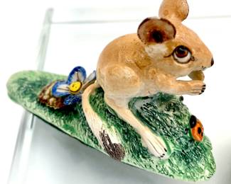 LOT 13 Register: www.woodardlipe.com SET OF 3 BASIL MATTHEWS FIGURINES/ BIG-EARED MOUSE WITH LADYBUG; FIELD MICE ON MUSHROOM, AND MICE ON GRASSY HILL Mouse with ladybug: length 3.25 in, depth .5 in, height 2 in. Mouse with mushroom: length 2 in, depth 1.75 in, height 1.75 in, Two mice: length 2 in, depth .25 in, height 1.25. Mathews was a Welsh potter who concentrated on limited edition pieces, usually producing no more than about a hundred of each model. An internationally acclaimed designer and figurine artist he was a Fellow of the Royal Society of Arts, Member of the Society of Industrial Artists and Designers, and Fellow of the Society of Design Craftsmen.