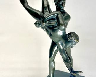 LOT 18 Register: www.woodardlipe.com AFTER JEAN DE BOLOGNE (BELGIAN 1580-1664) BRONZE WRESTLERS STATUE Height 6.5 in., width 5 in., depth 2.5 in., Solid petite bronze sculpture of Greco-Roman wrestlers. The sculpture showcases a moment of intense action during a wrestling match, capturing the strength and skill of the athletes. Screw and bolt attachment to base. Signed Jean de Bologne on base. The smooth musculature and flowing lines are characteristic of classical forms.