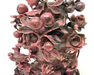LOT 54 Register: www.woodardlipe.com RARE GRAY AND PINK CARVED URN/CENSOR WITH OVERLAY OF FLOWERS, FRUIT AND BIRDS Length 3.75 in, width 2 in, height 5.5 in. with stand. 521 grams with stand. Intricately carved urn covered in an abundance of birds, flowers and fruit. Carving appears to represent the peach tree which represents longevity and immortality in Chinese culture. Carved hardstone is one of the oldest art forms in China and this mid-century piece is an excellent example of the mastery of the skill.