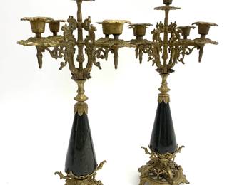 LOT 87 Register: www.woodardlipe.com PAIR BRASS AND BROWN/BLACK MARBLE 5 ARM CANDELABRA ITALIAN ROCOCO STYLE Diameter 9 in, height 18 in. Pair of cast brass candelabra with exquisitely detailed base stand and intricate sentry animals holding each of the four candleholders.