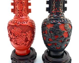 LOT 64 Register: www.woodardlipe.com CHINESE CARVED RED CINNABAR STYLE AND BLACK LACQUER CARVED VASE WITH BLUE ENAMEL INTERIOR Diameter 3 in, height 6.5 in without base. Beautifully carved cinnabar vase with black lacquer carving of Chinese dragons. Blue enamel interior and bottom with brass banding. Cinnabar is a mineral that Cinnabar has been used for thousands of years to make pigments, paints, and cosmetics.