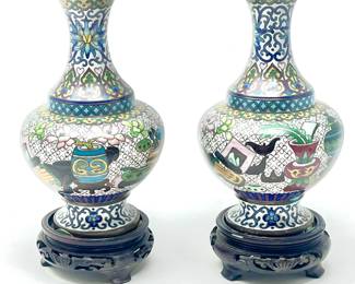 LOT 38 Register: www.woodardlipe.com PAIR CLOISONNE VASES ON CARVED WOODEN BASES Height 6.25 in., diameter 4 in., Green with Blue Hombre flowers and Butterfly on brass.