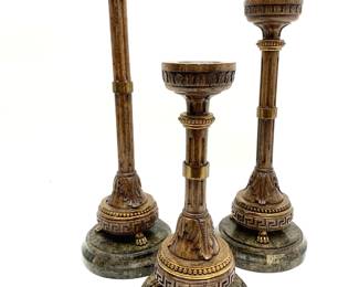 LOT 105 Register: www.woodardlipe.com SET 3 VINTAGE MAITLAND SMITH CANDLE HOLDERS WITH GREEK KEY DETAIL ON STONE BASE Diameter 7.5 in, height 21 in, 17.25 in, 13.5 in. Regal Candlesticks by luxury furniture manufacturer Maitland Smith with carved wood Romanesque leaf and Greek key decorations. The bases are tiled with stone veneer and the underside is labeled Maitland Smith, handmade in Philippines.