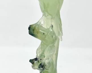 LOT 72 Register: www.woodardlipe.com CARVED LIGHT TRANSLUCENT SERPENTINE PHEASANT ON BRANCH Height 9 in., width 3.25 in., depth 2 in., Total weight 524 grams; the golden pheasant is considered a symbol of auspiciousness. It is also thought to be the ancestor of the phoenix, a mythical bird that symbolizes virtue and beauty. Serpentine is a translucent, waxy silicate of magnesium that's usually green in color. It's named for its mottled green patterns that resemble snakeskin.