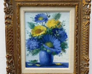 LOT 114 Register: www.woodardlipe.com L. CUEVAS (SPANISH B. 1929) OIL ON CANVAS OF BLUE AND YELLOW FLOWERS IN BLUE VASE Sight height 9.25 in, width 7.25 in, Framed height 15.25 in, width 13 in. Oil on canvas of a blue and yellow floral arrangement in blue vase. Signed by artist in lower right corner. L. Cuevas has exhibited throughout Europe and studied at the Academy of Arts in Madrid.