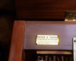 Pianola by the Aeolian Company. Measures 49 1/2 inches wide 26 inches deep and 39 inches tall.  Approximately 100 Pianola music scrolls for sale. History: The first practical pneumatic piano player, manufactured by the Aeolian Company and called the "Pianola",[3] was invented in 1896 by Edwin S. Votey, and came into widespread use in the 20th century. The name "pianola", sometimes used as a generic name for any player piano, came from this invention. The mechanism of this player piano was all-pneumatic: foot-operated bellows provided a vacuum to operate a pneumatic motor and drive the take-up spool, while each small inrush of air through a hole in the paper roll was amplified in two stages to sufficient strength to strike a note.