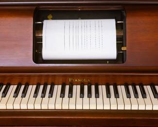 Pianola by the Aeolian Company. Measures 49 1/2 inches wide 26 inches deep and 39 inches tall.  Approximately 100 Pianola music scrolls for sale. History: The first practical pneumatic piano player, manufactured by the Aeolian Company and called the "Pianola",[3] was invented in 1896 by Edwin S. Votey, and came into widespread use in the 20th century. The name "pianola", sometimes used as a generic name for any player piano, came from this invention. The mechanism of this player piano was all-pneumatic: foot-operated bellows provided a vacuum to operate a pneumatic motor and drive the take-up spool, while each small inrush of air through a hole in the paper roll was amplified in two stages to sufficient strength to strike a note.