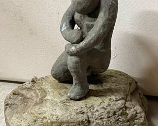 139 HandCraftedWomanDefeatedStatueMountedonRock