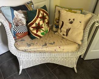 White Wicker Bench with Floral Cushion, Assortment of Throw Pillows