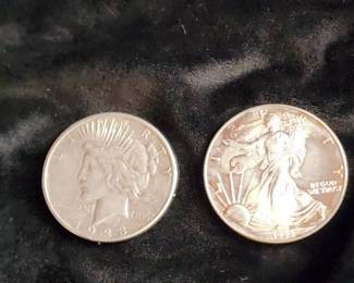 1923 Peace Dollar and 1999 American Silver Eagle Coins