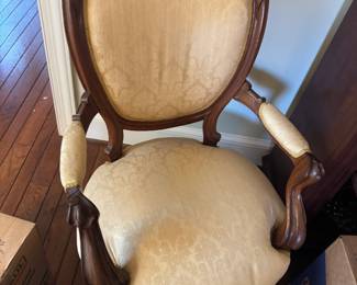 One of a pair of antique arm chairs