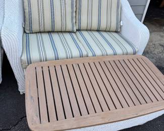 White faux wicker love seat and coffee table
