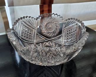 Antique cut glass bowl with scalloped rim and large pinwheels