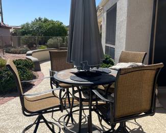 $295- Patio Table & Umbrella with Swivel Chairs and Built in Ice Bucket. Includes covers for the umbrella, chairs and table 