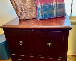 Upright push button blanket chest