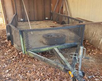 Super nice landscape trailer with iron metal gate and sheet metal flooring.