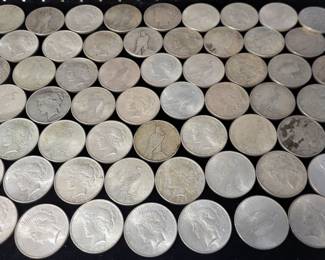 Dozens of Peace dollars (U.S. Silver coin)