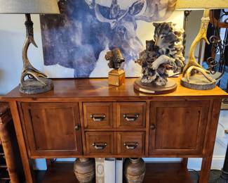 cottage console with art figurines