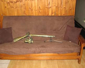 Vintage wood frames couch, hunting themed wall decor