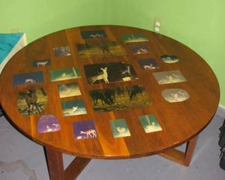 Round coffee table with deer pictures clear coated over