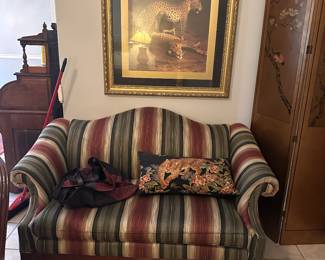 Beautiful leopard print in a large gold gilded frame
Stripped loveseat