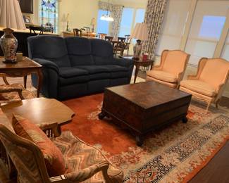 Living room furniture with Persian rug. 