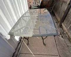 Home and Gardens glass patio table 