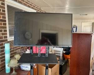 small TV on portable moving stand