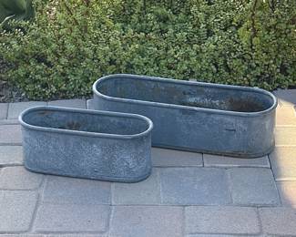 Two galvanized metal planters