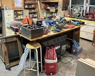 This is another view of the central table.  Underneath the table is a large television.  There are a couple of older-style tool carriers.  Again, come by the sale to see what it has.