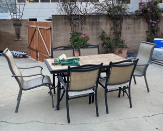 Outside in the back you'll find a decent patio table and chairs.