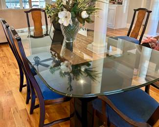 Custom glass top table (7’4 by 4’2”) with tobacco leaf wrapped base and 8 chairs