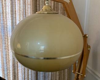 #41	midcentury look floor lamp with tan plastic globe 62 inch tall 	 $75.00