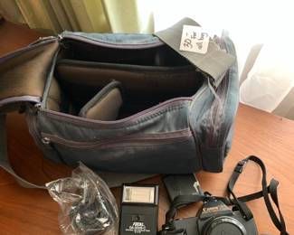 #157	Cannon camera with extra lens and flash  and bag 	 $30.00