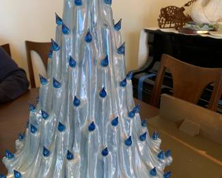 #61	Blue porcelain Christmas tree 2 piece lighted as is missing 1 light 20 tall 	 $100.00