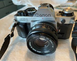 Nice clean Canon AE-1 camera ( We also have an accessory lens and case.)