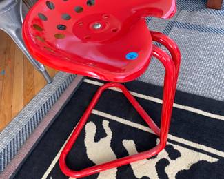 Cute red tractor seat chair.