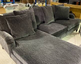 L-shaped modern gray upholstered sectional divan.
