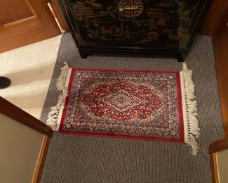 One of several small rugs.